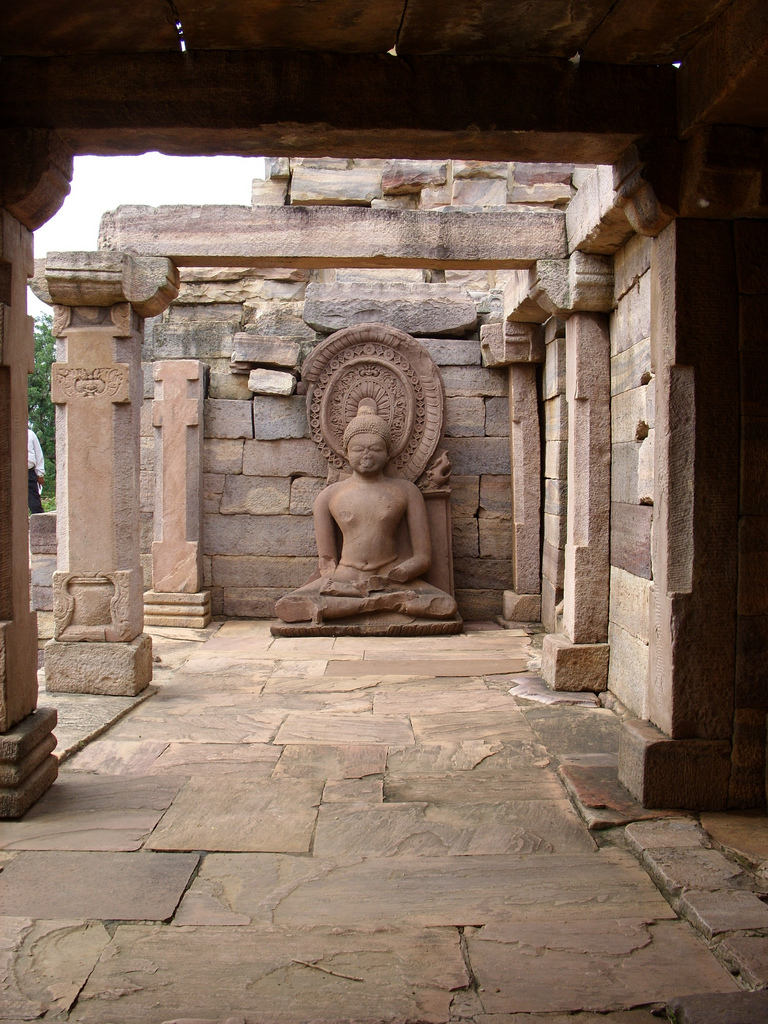 A sitting Buddha statue inside one of the temples
